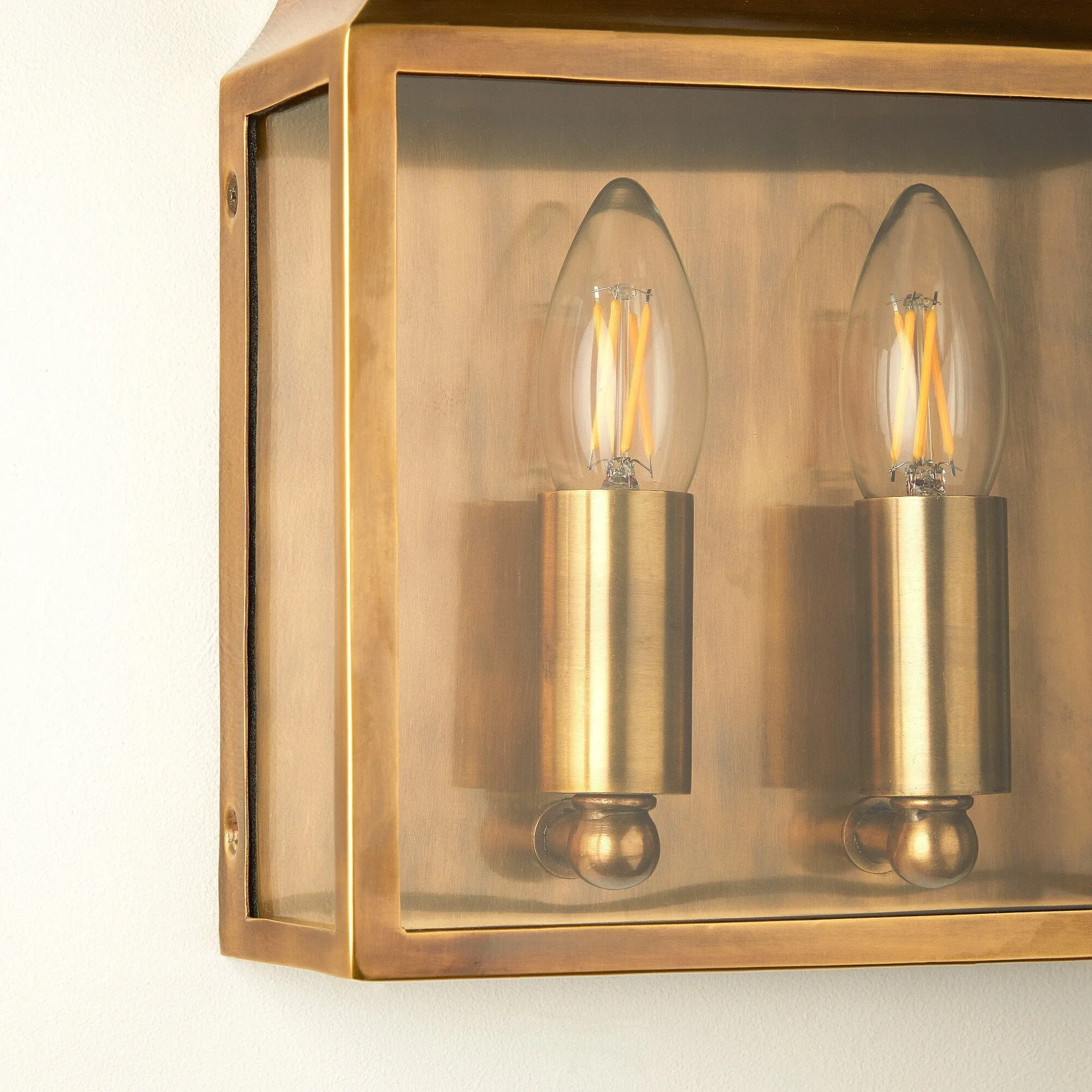 Double Crail IP44 exterior wall light in antique brass