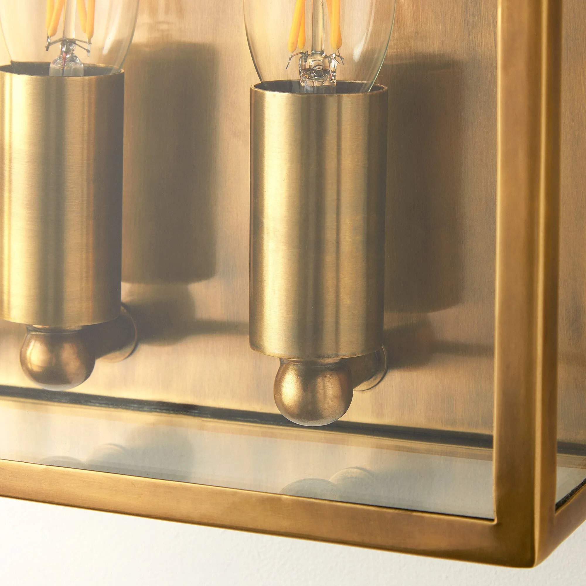 Double Crail IP44 exterior wall light in antique brass