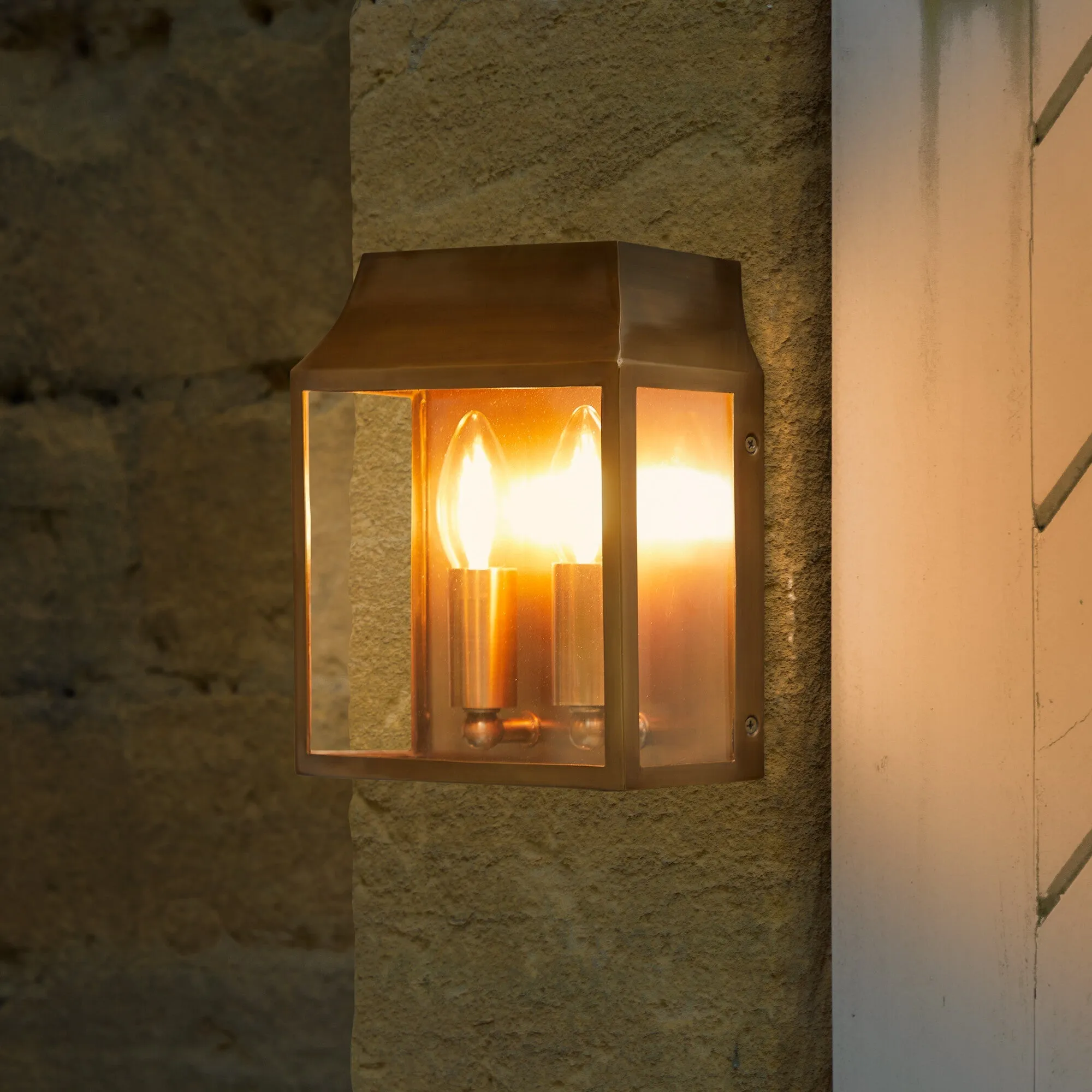 Double Crail IP44 exterior wall light in antique brass