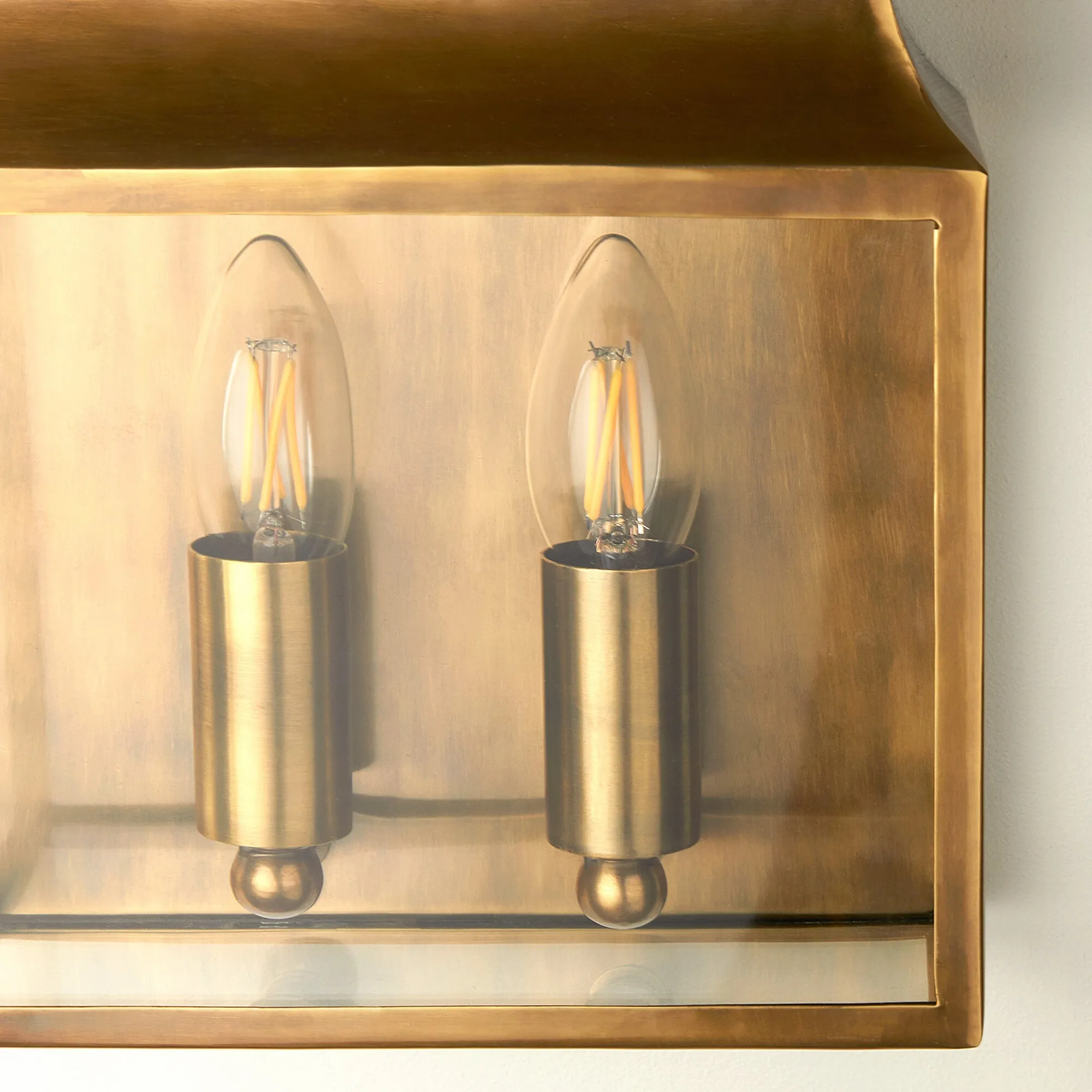 Double Crail IP44 exterior wall light in antique brass