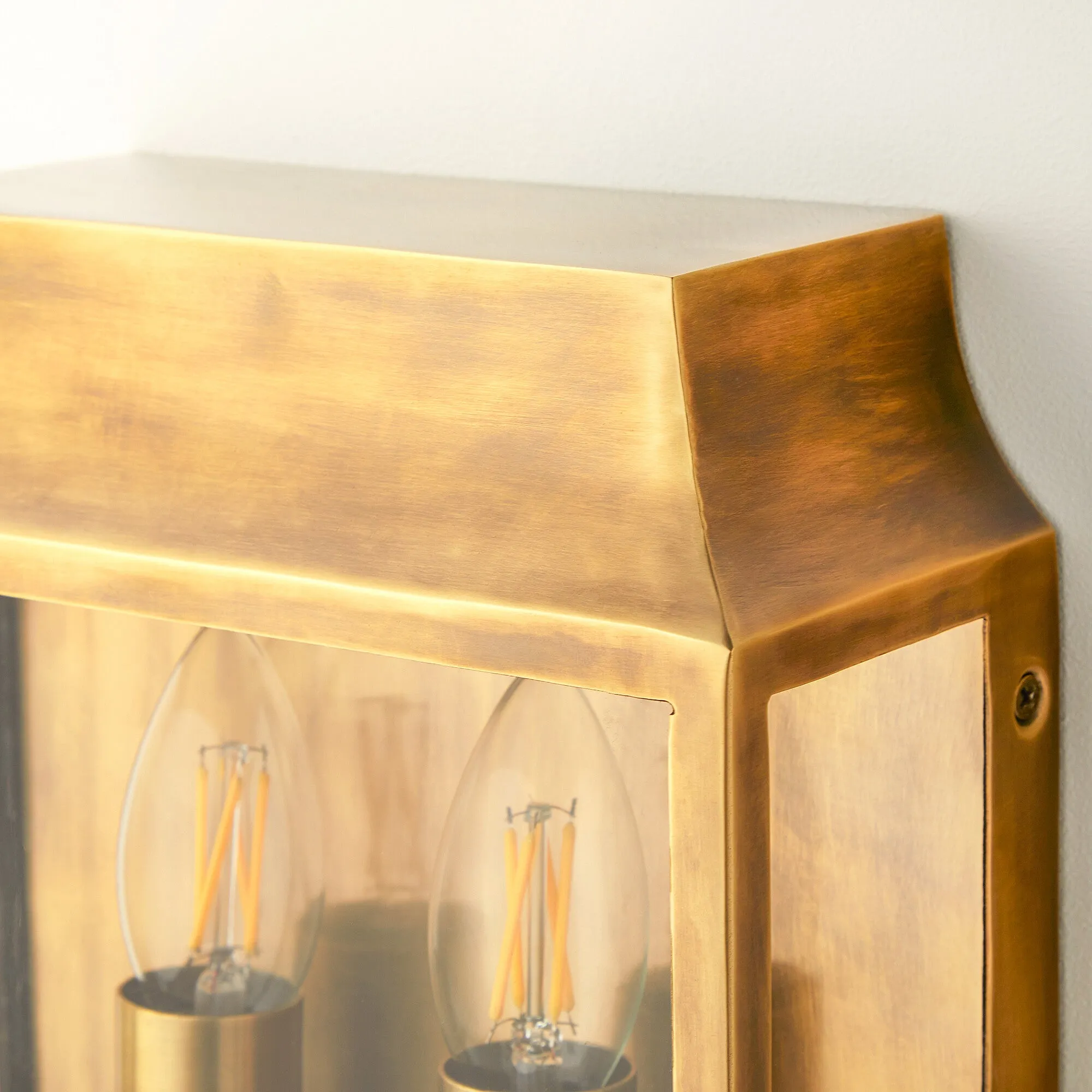Double Crail IP44 exterior wall light in antique brass